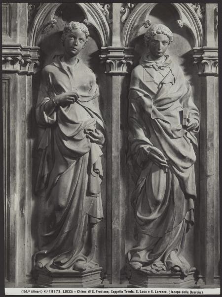 Lucca - Chiesa di S. Frediano. Jacopo della Quercia, Cappella Trenta, S. Luca e S. Lorenzo, particolare del polittico in marmo (1422).