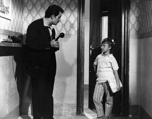 Scena del film "Appuntamento a Ischia" - Regia Mario Mattoli - 1960 - Gli attori Domenico Modugno, al telefono, e Maria Letizia Gazzoni