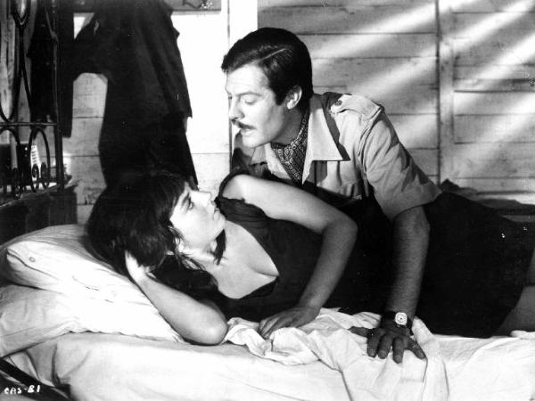 Scena del film "Casanova '70" - Regia Mario Monicelli - 1964 - Gli attori Marcello Mastroianni e un'attrice non identificata a letto