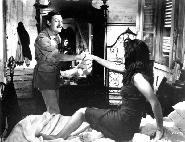 Scena del film "Casanova '70" - Regia Mario Monicelli - 1964 - L'attore Marcello Mastroianni e un'attrice non identificata a letto