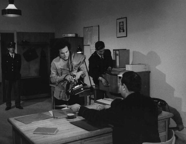 Scena del film "Colpo di stato" - Regia Luciano Salce - 1968 - L'attore Dimitri Tamarav e tre attori non identificati al commissariato