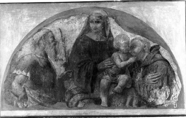 La Madonna col Bambino, un santo martire e un santo francescano