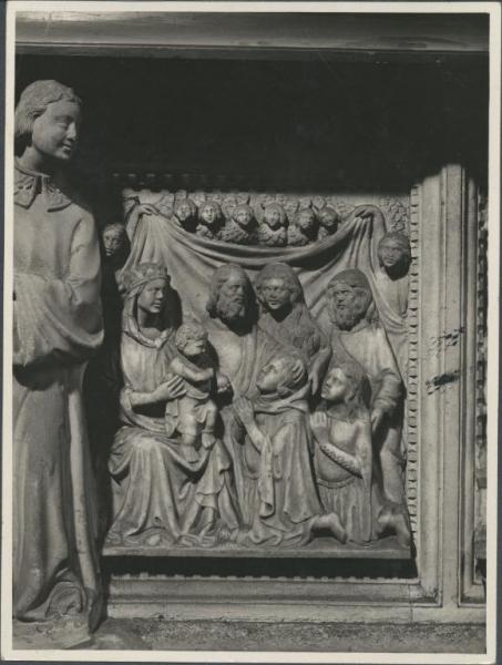 Rilievo - Madonna con Bambino, Santi e due devoti - Giovanni da Campione - Carpiano - Chiesa parrocchiale di S. Martino - Altare maggiore