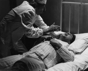 Scena del film "Oh! Serafina" - Regia Alberto Lattuada - 1976 - L'attore Renato Pozzetto a letto con un infermiere