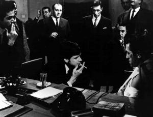 Scena del film "Banditi a Milano" - Regia Carlo Lizzani - 1968 - Gli attori Tomas Milian, Ezio Sancrotti e attori non identificati