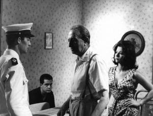 Scena del film "Carmen di Trastevere" - Regia Carmine Gallone - 1962 - Gli attori Giovanna Ralli, Jacques Charrier, in divisa da poliziotto, e due attori non identificati