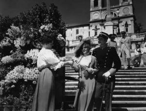 Scena del film "Cavalleria" - Regia Goffredo Alessandrini - 1936 - Gli attori Elisa Cegani e Amedeo Nazzari da una fioraia sulla scalinata di piazza di Spagna a Roma