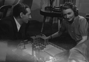 Fotografia del film "La danza dei milioni" - Regia Camillo Mastrocinque 1940 - L'attore Nino Besozzi e l'attrice Jole Voleri seduti.