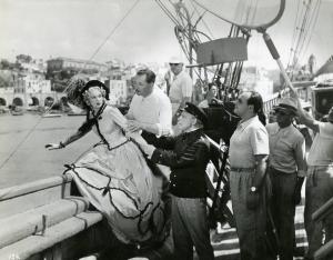 Sul set del film "Il dottor Antonio" - Regia Enrico Guazzoni, 1937 - Da sinistra, Maria Gambarelli, Enrico Guazzoni, Lamberto Picasso e Gino Talamo, aiuto regista, provano una scena a bordo del panfilo "Lucy".