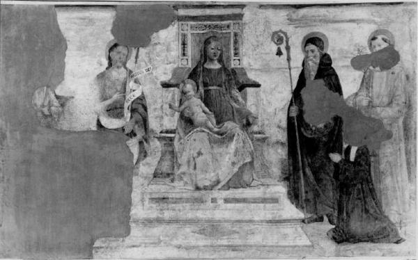Madonna col Bambino in trono tra i San Giovanni Battista, sant'Antonio abate, Sant'Antonio da Padova, un santo francescano e donatrice
