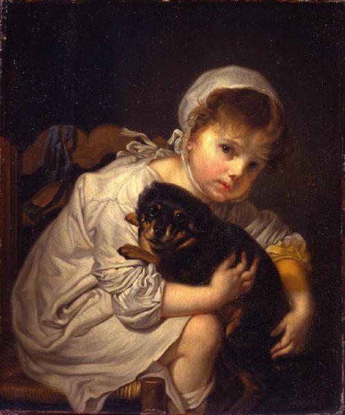 Bambina che gioca con un cagnolino nero