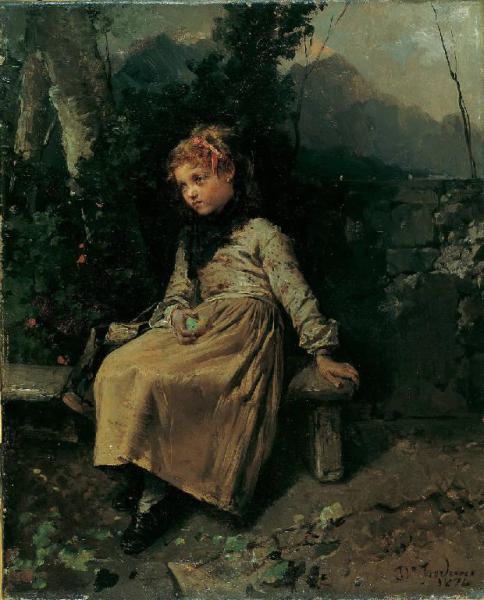 Bambina seduta in giardino